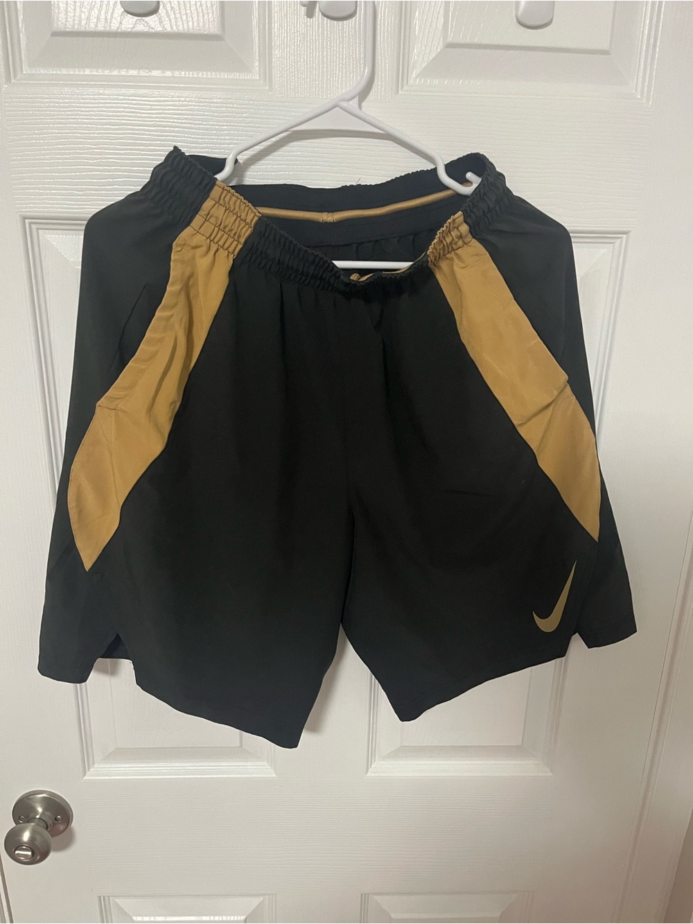 Nike Black Athletic Shorts with Gold Panels
